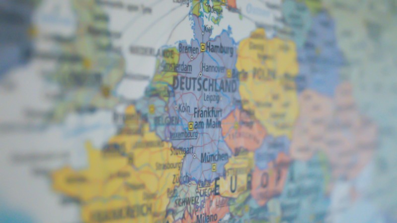 Close-up view of Germany on a colorful world map showing major cities., tags: die und - pexel